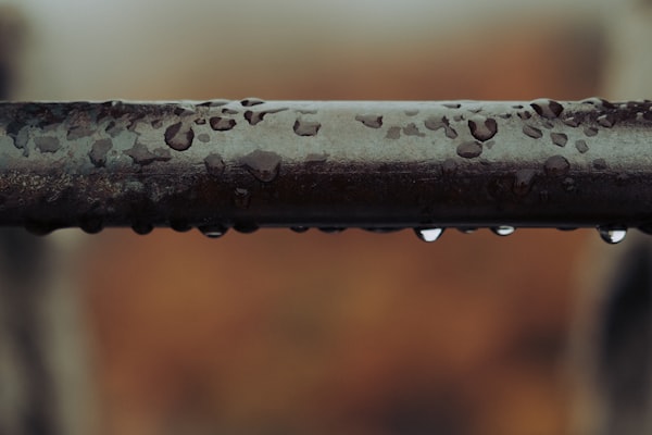 Water dripping from pipe representing emergency plumbing